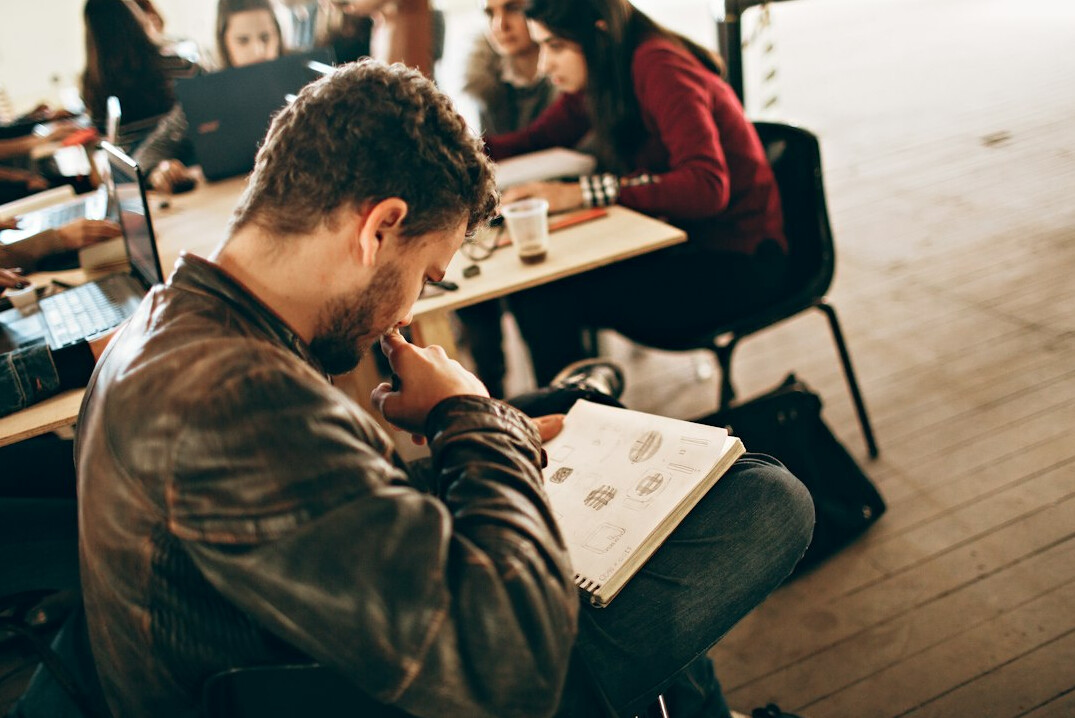 man listening in meeting